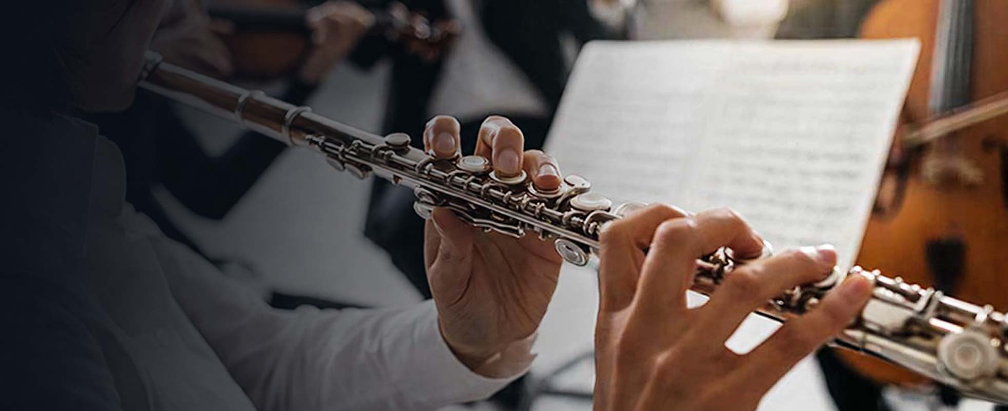 Flutist performing with the orchestra